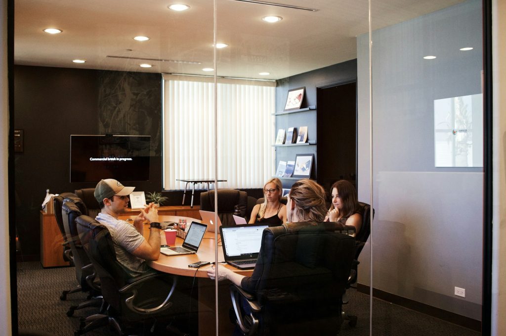 Content creators in a conference room discussing the best keywords for commercial and investment real estate.