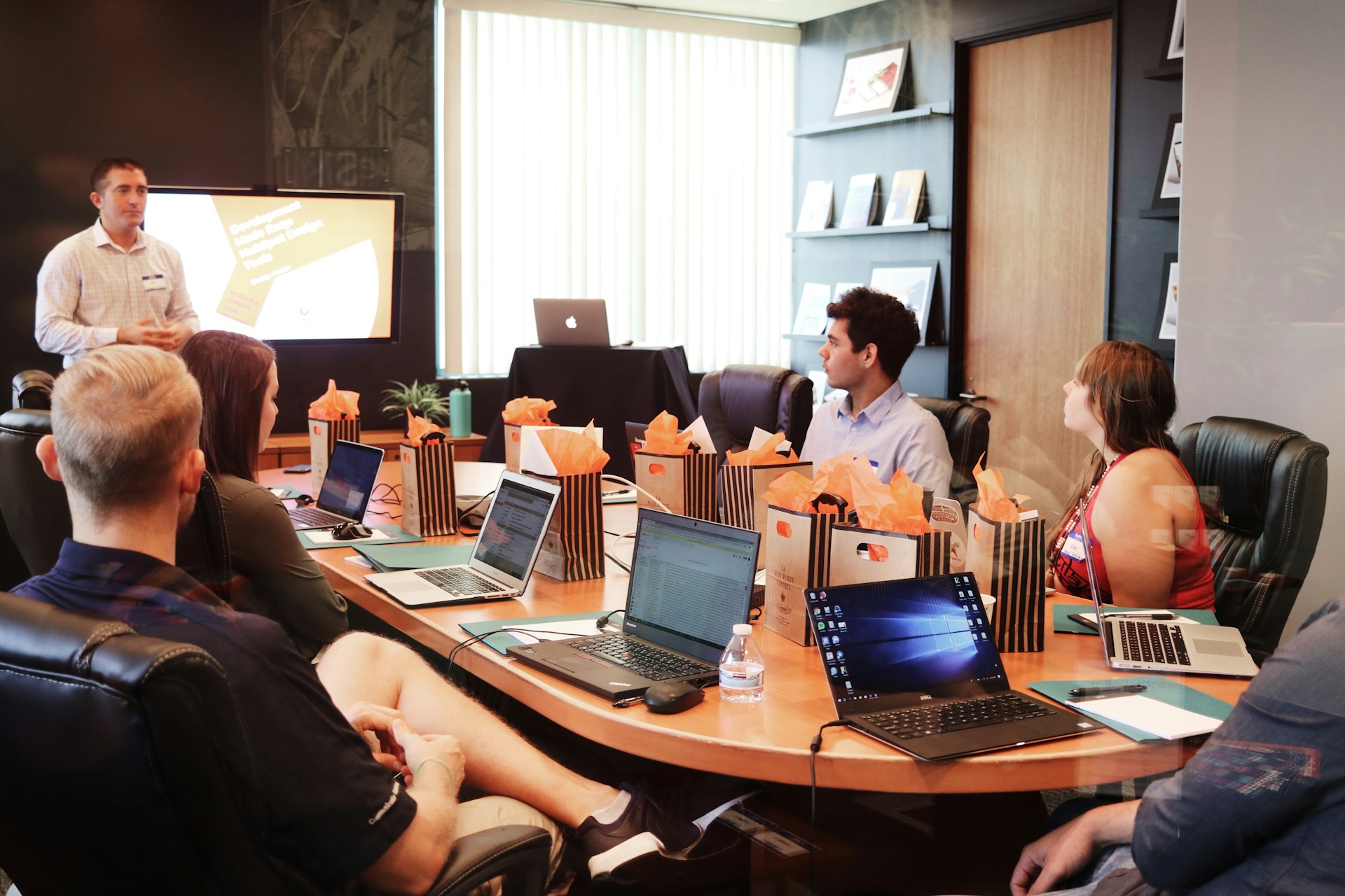 A group of diverse professionals collaborating around a table, brainstorming ideas and crafting compelling narratives for business