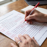 Real estate editor marking article claims, fair housing language, and marketing notes before publication
